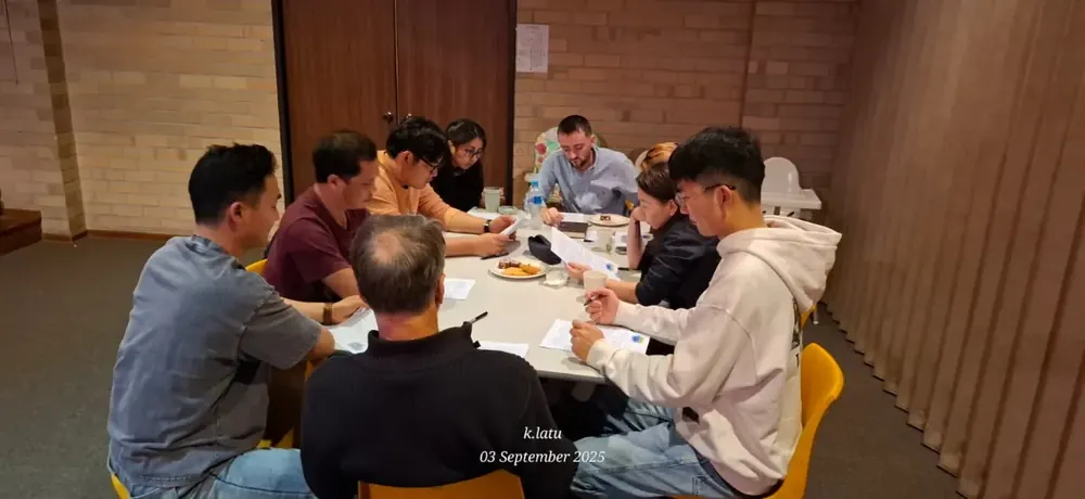 Small group studying around a table