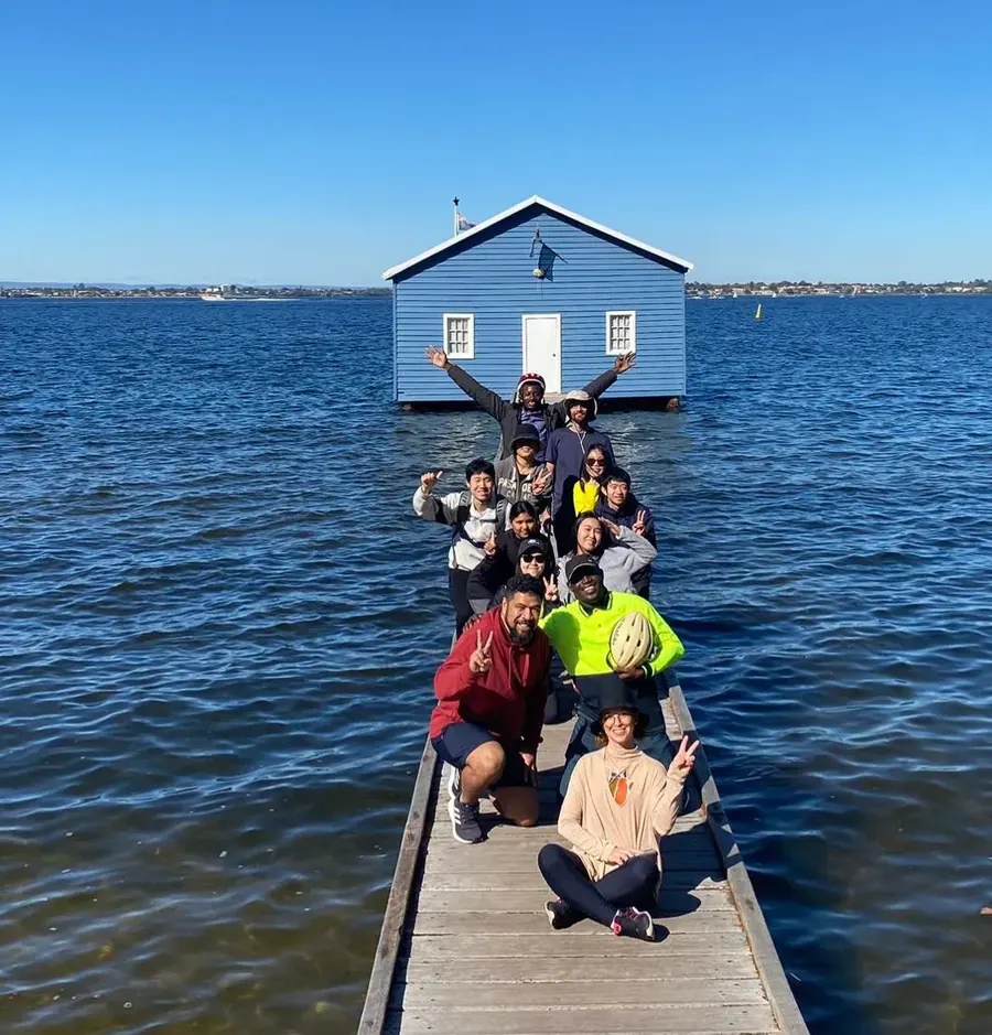Young adults from the church on the jetty at the Crawley Edge Boatshed